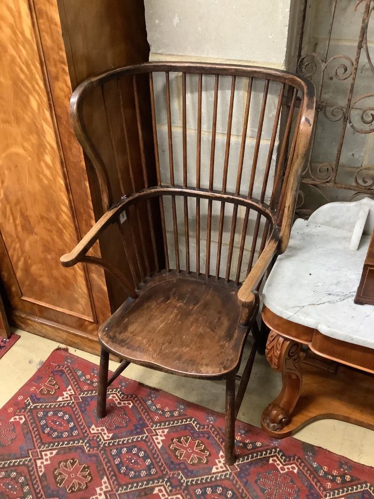 An early 20th century ash and beech Windsor comb back armchair, width 65cm, depth 60cm, height 115cm